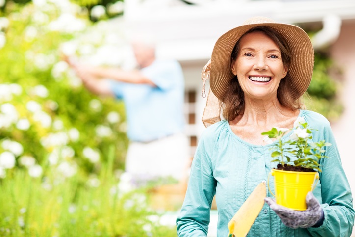 older woman with plant